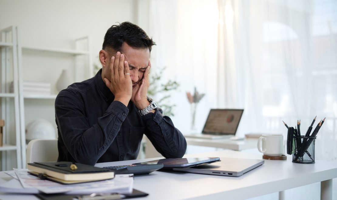 Leader experiencing workplace burnout and mental fatigue during work